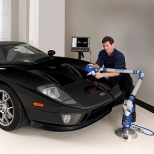 3d_scan_car An employee is 3d scanning a car.